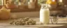 Glass of THC milk with cannabis leaves beside it