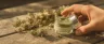 THC pain relief rub applied to sore shoulder muscle