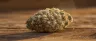 Close-up of dense Wedding Cake cannabis buds coated in trichomes