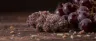 Grape Ape cannabis buds with purple foliage