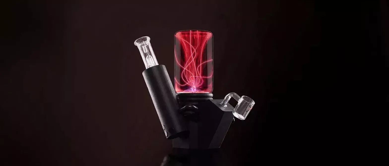 Modern black bong with a red glowing plasma chamber and glass attachments.