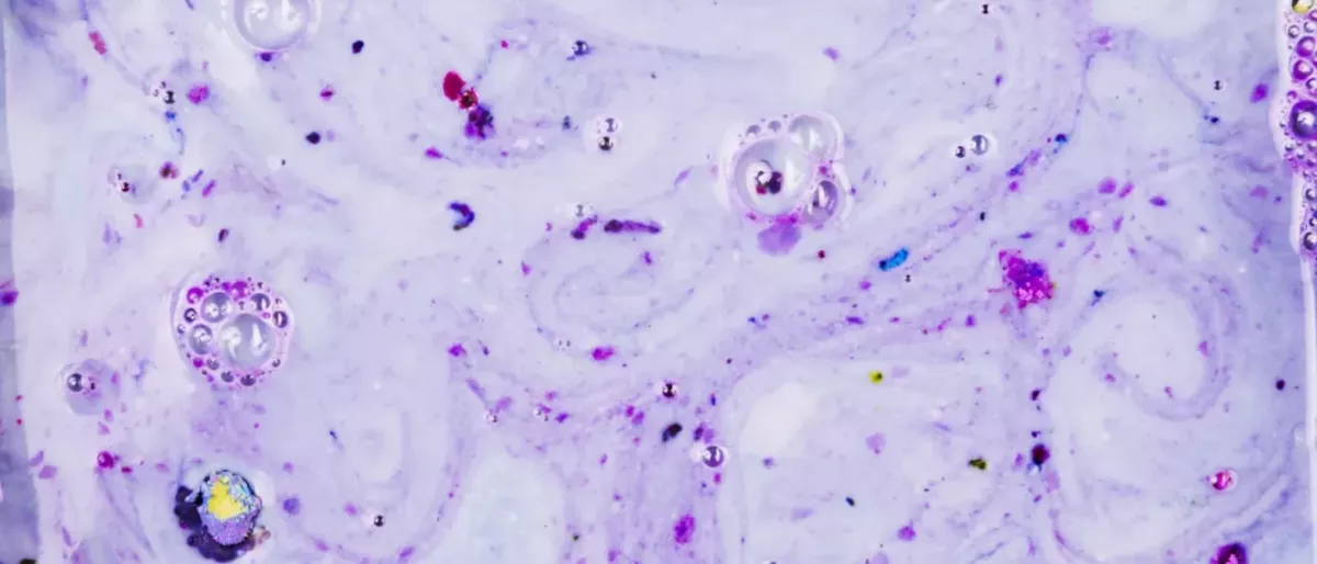 CBD bath bomb fizzing in warm water