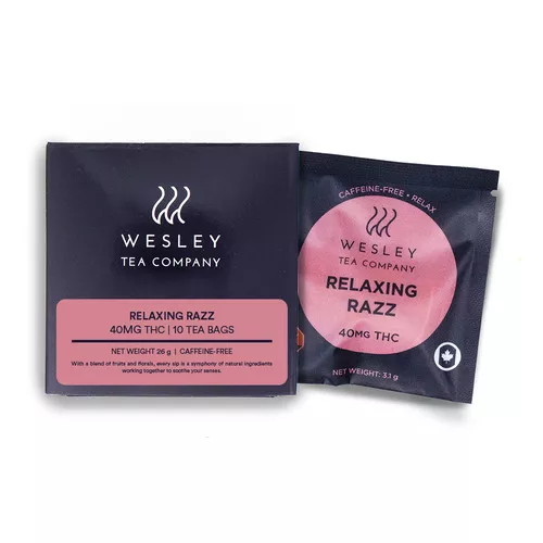 Wesley tea company box and tea bag, pink and black design, labeled relaxing razz.