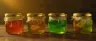 cannabis jelly cubes dusted in sugar on wooden board
