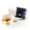 CBD-THC capsules bottle with scattered capsules on a white surface.