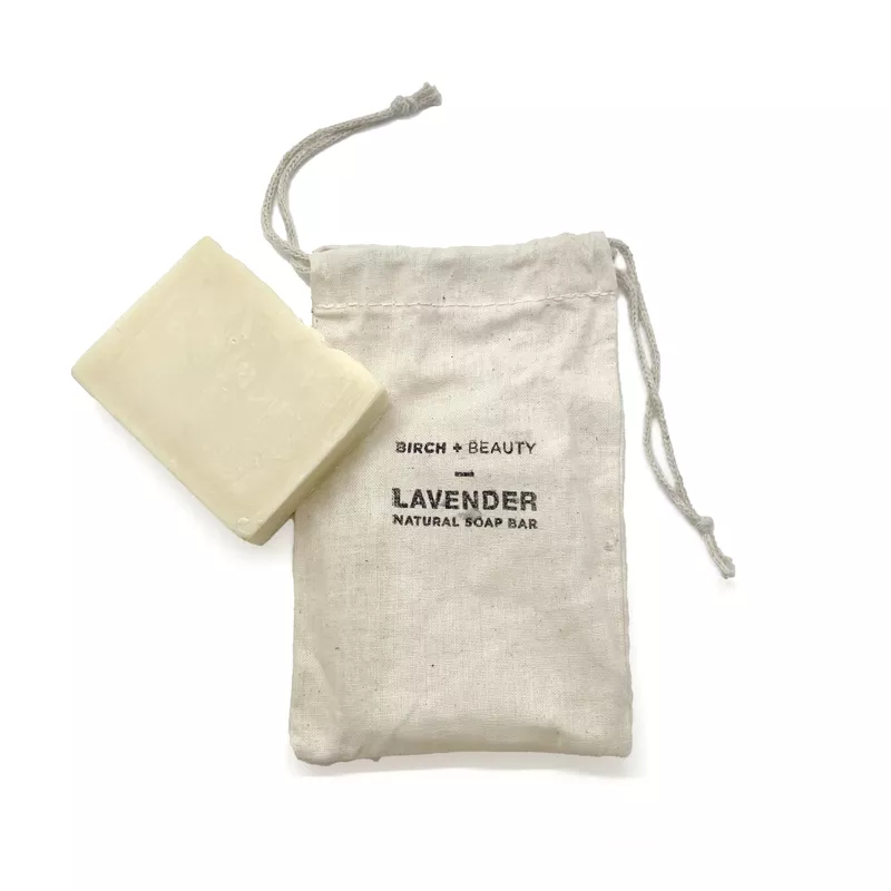 Birch + Beauty artisanal lavender soap bar with eco-friendly canvas pouch.