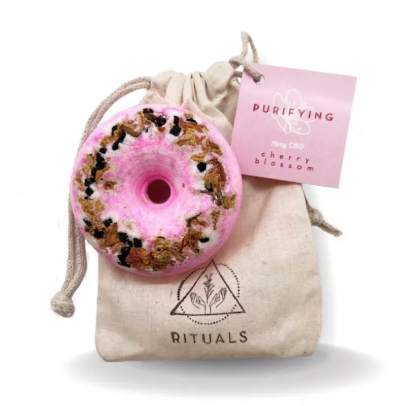 Rituals cherry blossom CBD bath bomb with pouch on white background.