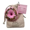 Purifying CBD bath bomb with cherry blossom scent and drawstring bag.