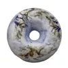 Light blue bath bomb with embedded dried herbs and flowers.