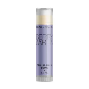 CBD-infused Berry Martini lip balm by Birch + Beauty in a sleek, purple-labeled tube.