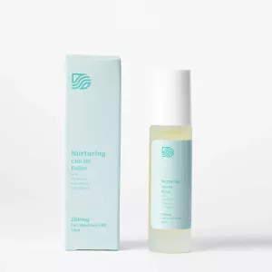Nurturing CBD oil roller with 250mg full-spectrum CBD and essential oils in minimalist packaging.
