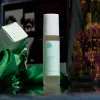 Nurturing CBD oil roller with Vitamin E, dried flowers, and motivational message.