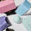 Flat lay of CBD bath bombs and self-care accessories.
