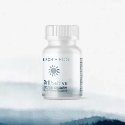 Birch + Fog Sativa 3:1 CBD/THC Capsules, 30ct against tranquil backdrop.