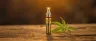 CBD cartridge attached to 510-thread vape pen