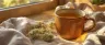 warm cup of cbd tea with hemp leaves