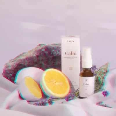 CALYX Calm spray with natural ingredients for relaxation and stress relief on pastel background.