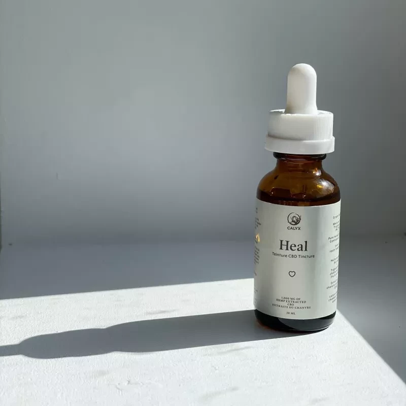 Calyx Heal 30ml CBD tincture bottle with 1000mg concentration on white background.