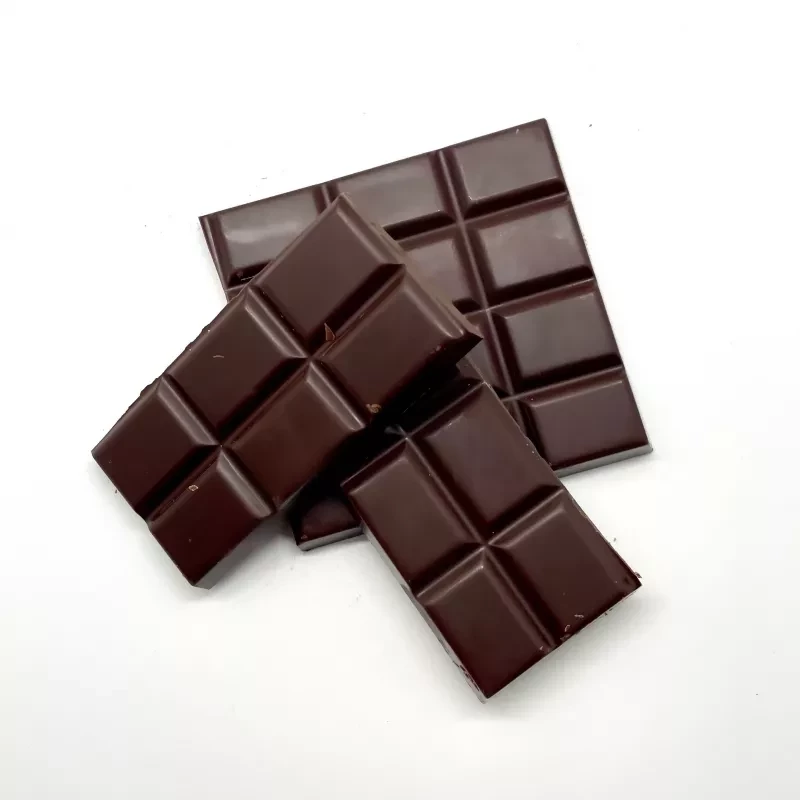 Two glossy, premium dark chocolate bars displayed on white background.