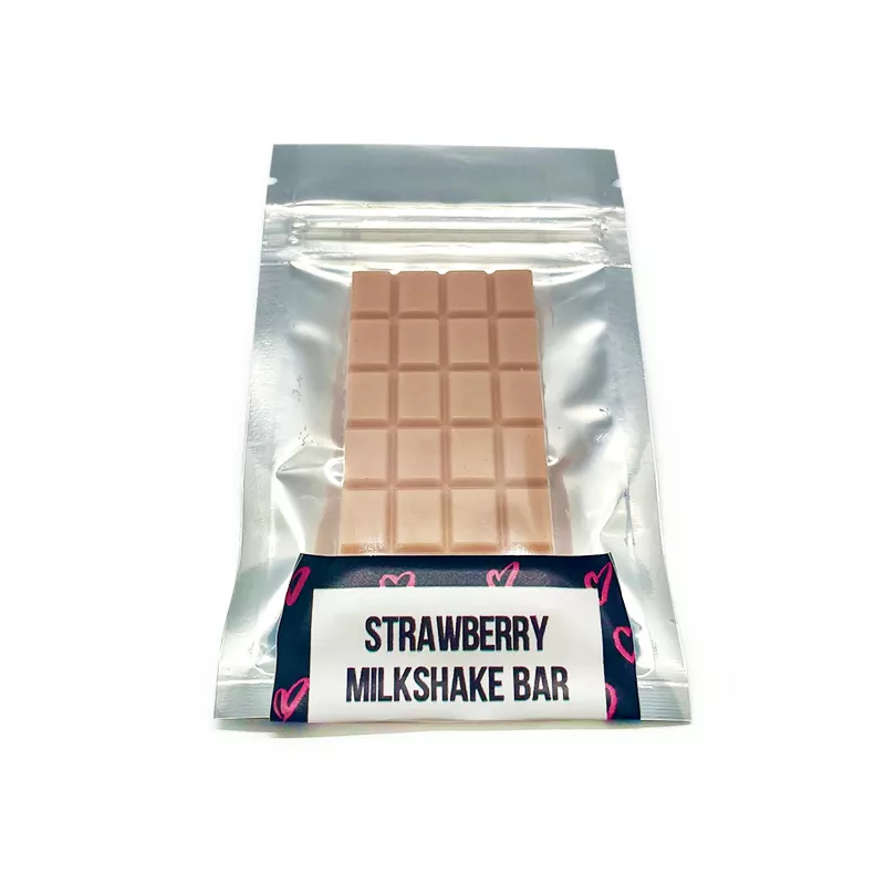 Strawberry Milkshake flavored THC-infused chocolate bar with playful heart design on the wrapper.
