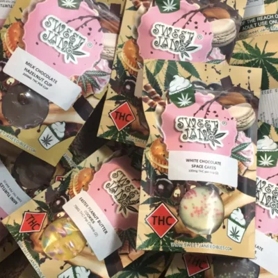 Sweet Jane cannabis chocolates with assorted flavors and THC content labels.