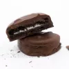 Chocolate-covered sandwich cookies with white cream filling on a white background.