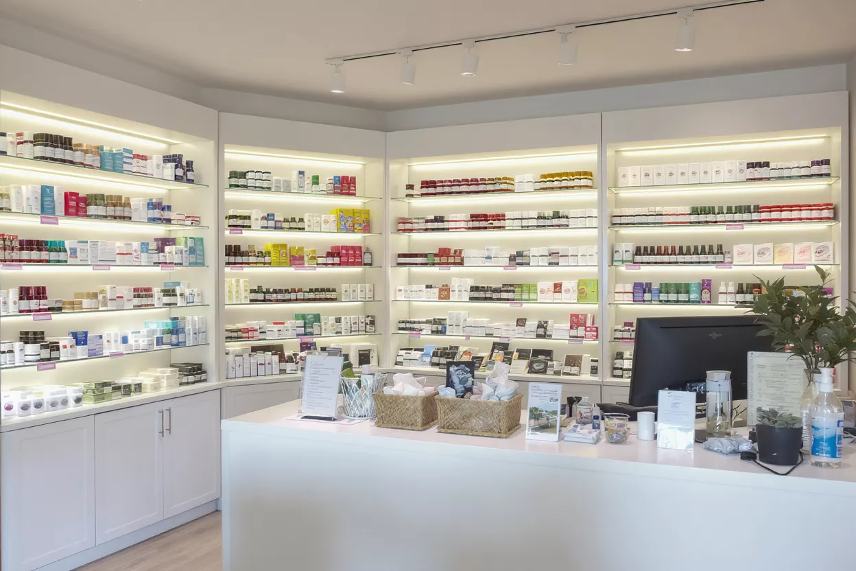 Modern Pharmacy Wellness Store Interior Interior of a modern pharmacy or wellness store with well-lit shelves.