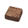A rich chocolate brownie square on a white background