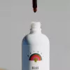 Minimalist white bottle with Rainbo 11:11 label, dropper adding brown liquid.