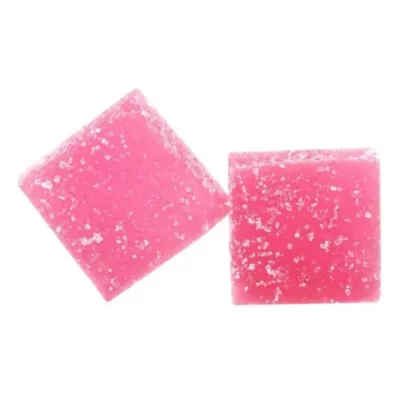 Bliss Edibles watermelon-flavored THC gummy squares with white specks on white background.