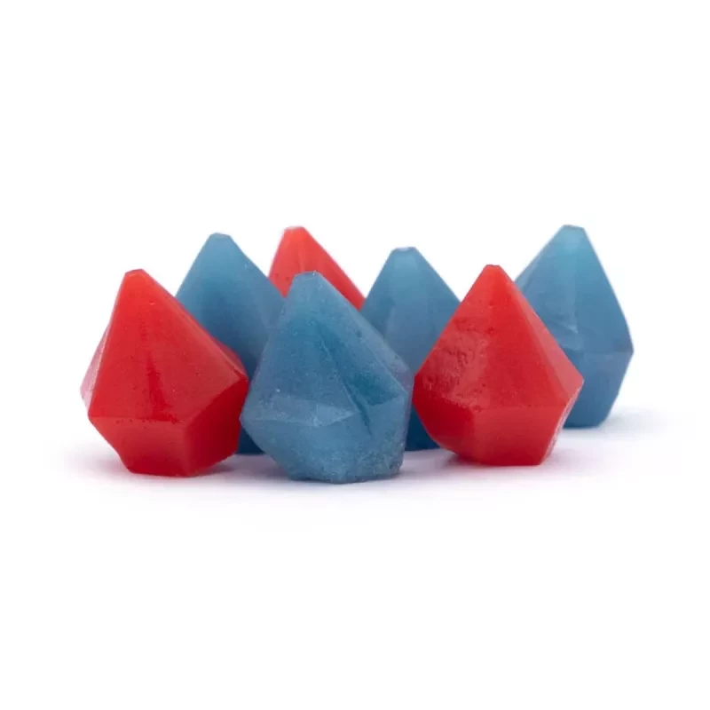 Vibrant red and blue faceted gemstone crystals arranged in a striking pattern.