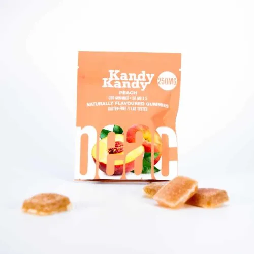 Kandy Kandy 250mg peach-flavored CO2 extracted gummies on white background.