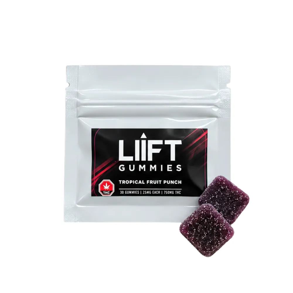 White pouch of Liift Tropical Fruit Punch gummies with two purple gummies beside it.