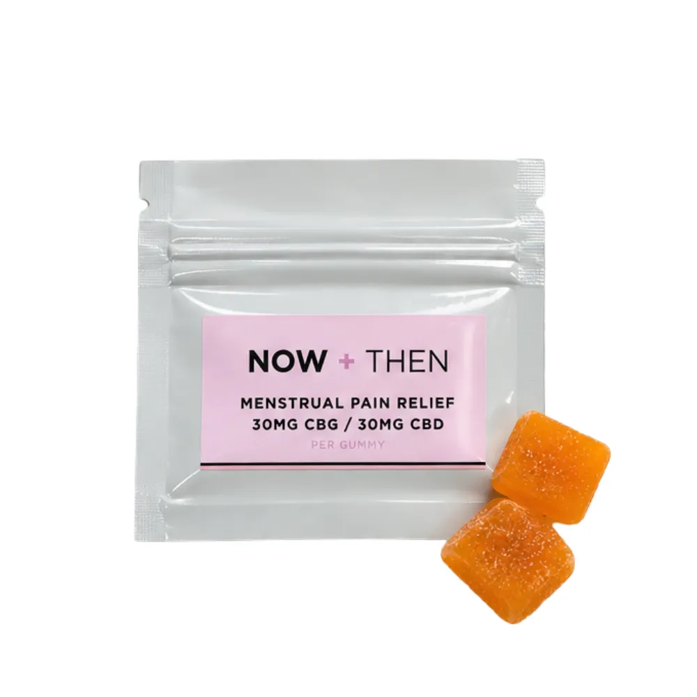 Now + Then Menstrual Pain Relief Gummies White pouch of Now + Then menstrual pain relief gummies with two orange gummies.