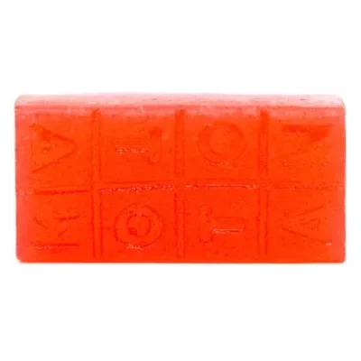 Vibrant orange embossed soap bar with decorative patterns and glossy finish.