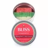 Colorful gummy candies in a round tin labeled bliss, featuring red, green, and yellow squares.