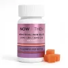 Bottle of gummies for menstrual pain relief with orange gummies nearby.