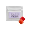 Now + Then Sweet Dreams Gummy pouch with two red-orange gummies beside it.