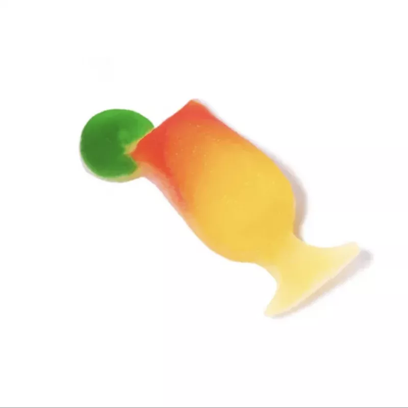 THC-infused tropical fruit gummy candy, glossy mango-like gradient from green to yellow.