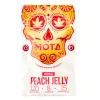 Cannabis-infused peach jelly by MOTA with 120mg THC in vibrant skull packaging.