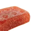 Close-up of a red-orange sugar-coated gummy candy.
