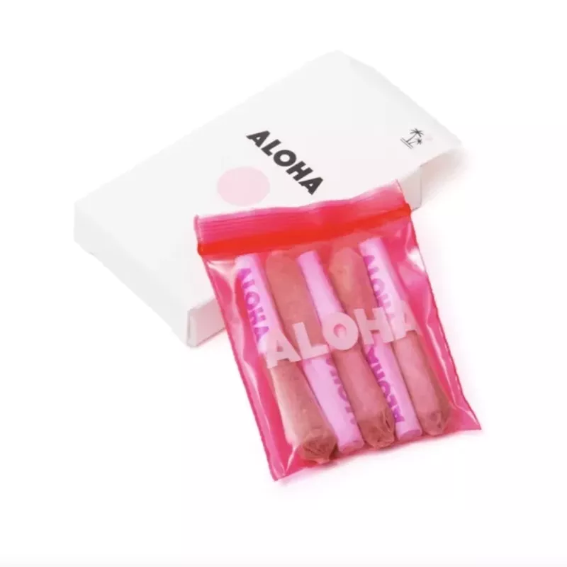 Aloha Tropical Indica Snack Pack with Pre-Rolled Portions in Pink Packaging.
