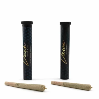 Dusk Indica and Dawn Sativa pre-rolled joints in labeled containers for strain-specific effects.