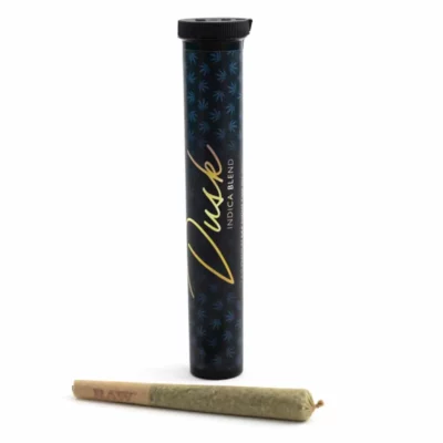 Dusk Indica Blend cannabis in container with RAW pre-rolled cone on white background.