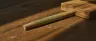 cigarette style pre rolls lined up on white surface