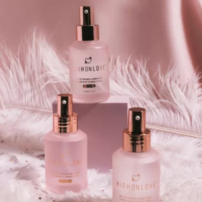 Luxury HighOnLove water-based lubricant in frosted pink bottles with metallic caps.