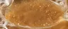 close-up of amber cannabis sugar wax concentrate