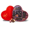 Heart-shaped red chocolate box labeled Love Bombs with truffles, romantic gift idea.