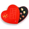 Heart-shaped box with assorted cannabis-infused chocolate Love Bombs, vibrant design, and THC symbol.