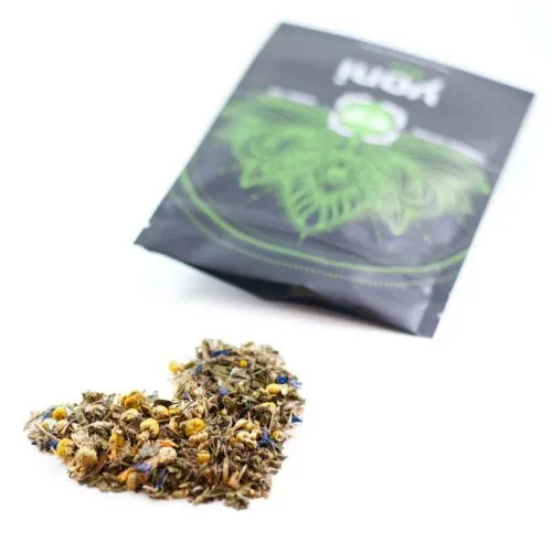 Heart-shaped herbal tea blend with colorful petals, natural relaxation product with leaf logo.